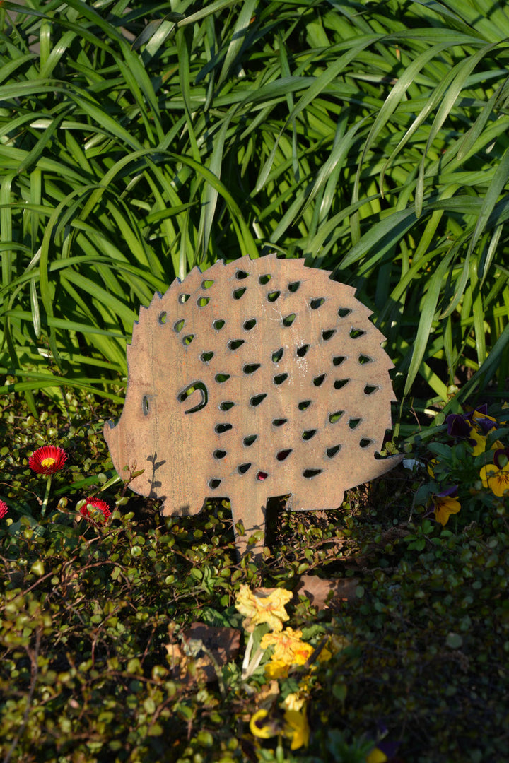 Large hedgehog as a plant stake